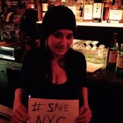 "The beautiful Cal of Three of Cups underground bar showing her support for #SaveNYC." Photo: Ella Vader